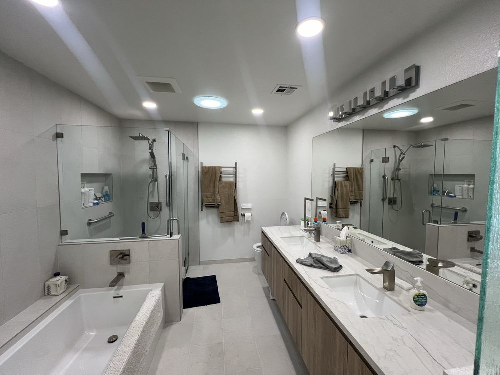 Glass shower enclosure with subway tile