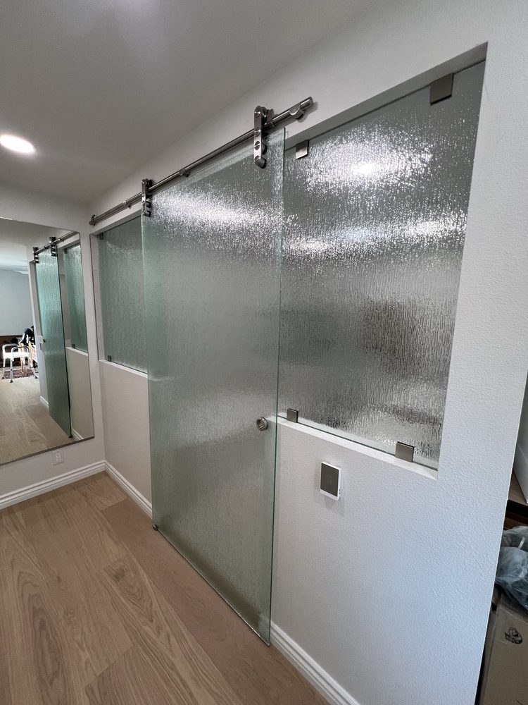 Large custom wall mirror installation