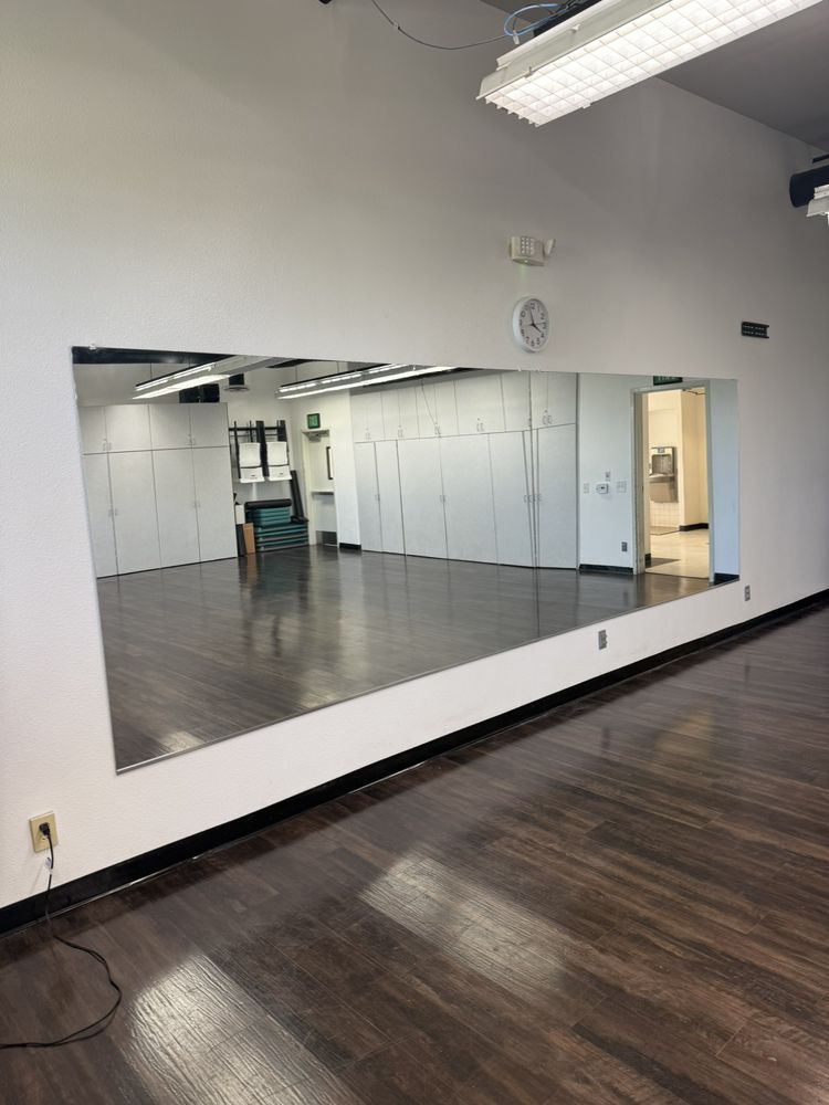 Large custom wall mirror installation