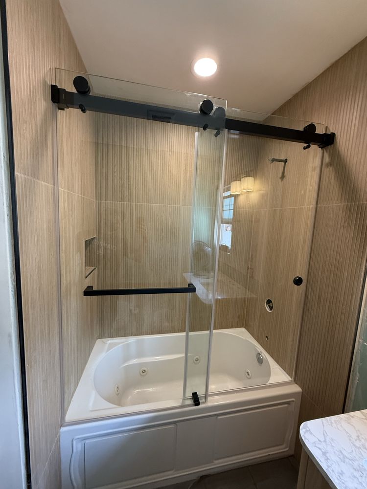 Custom frameless shower enclosure installation